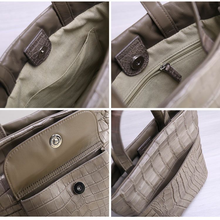 豊富なミニポケットが付いたハンドバッグ